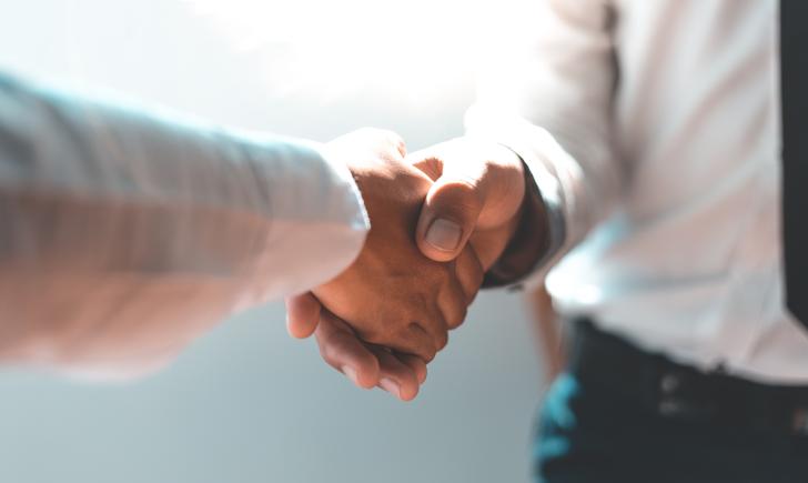 two people shaking hands