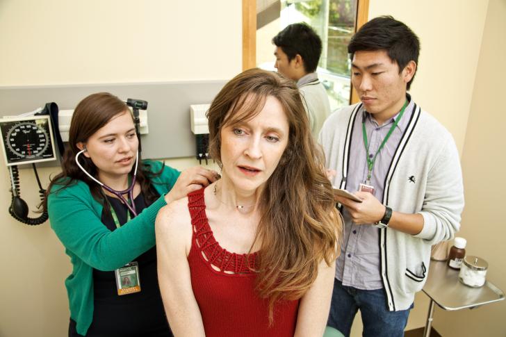 two doctors seeing patient