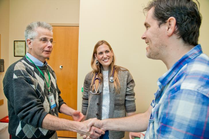 two clinicians with patient