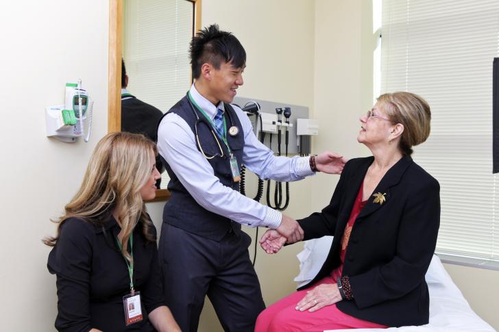 clinician shaking hands with patient