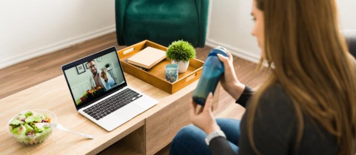 Young woman on a video call with a nutritionist