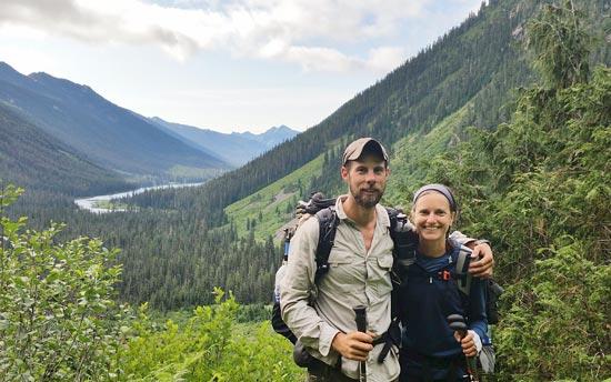 two people standing in a valley