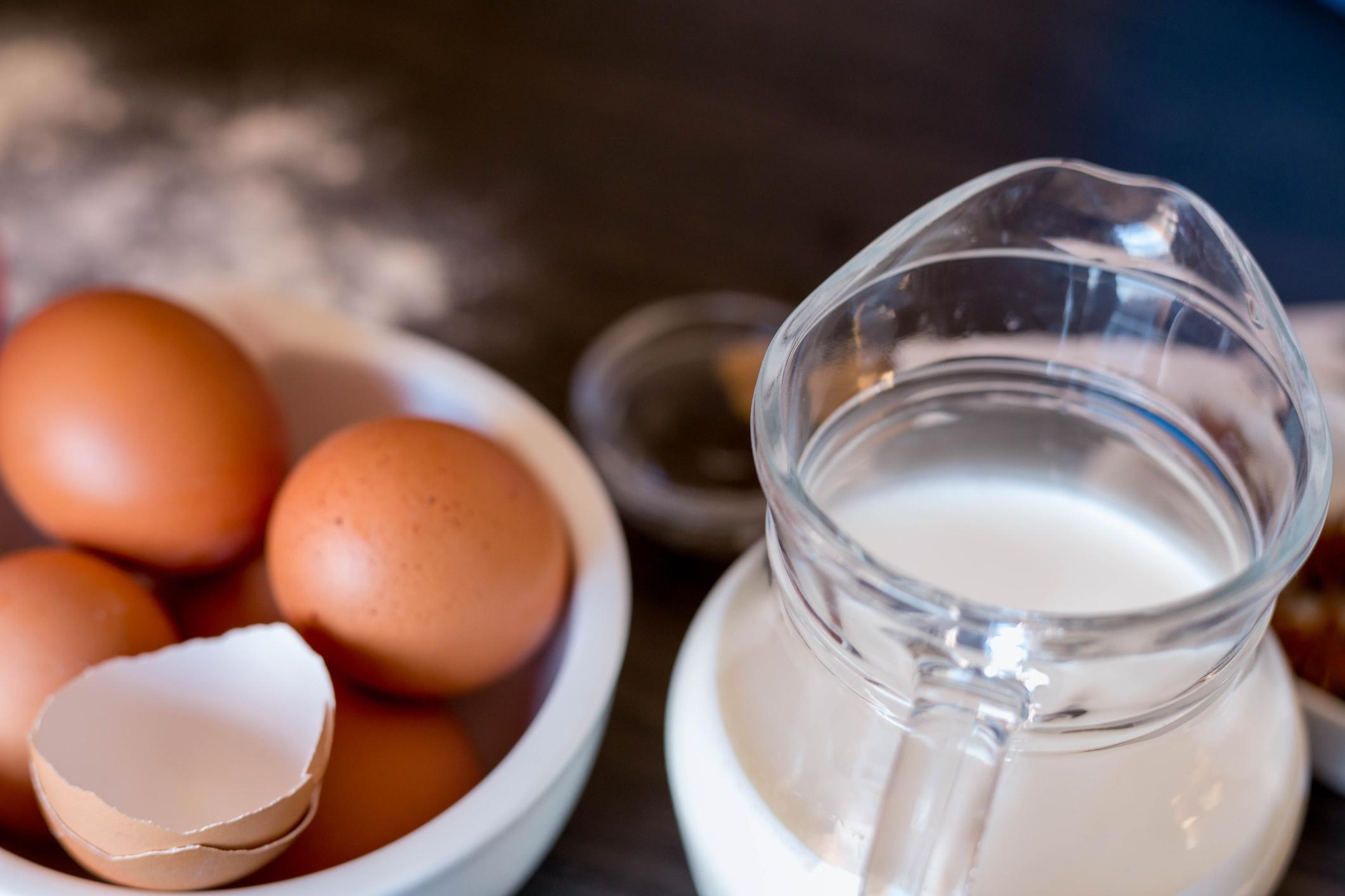 bowl of eggs and separated egg whites in measuring cup