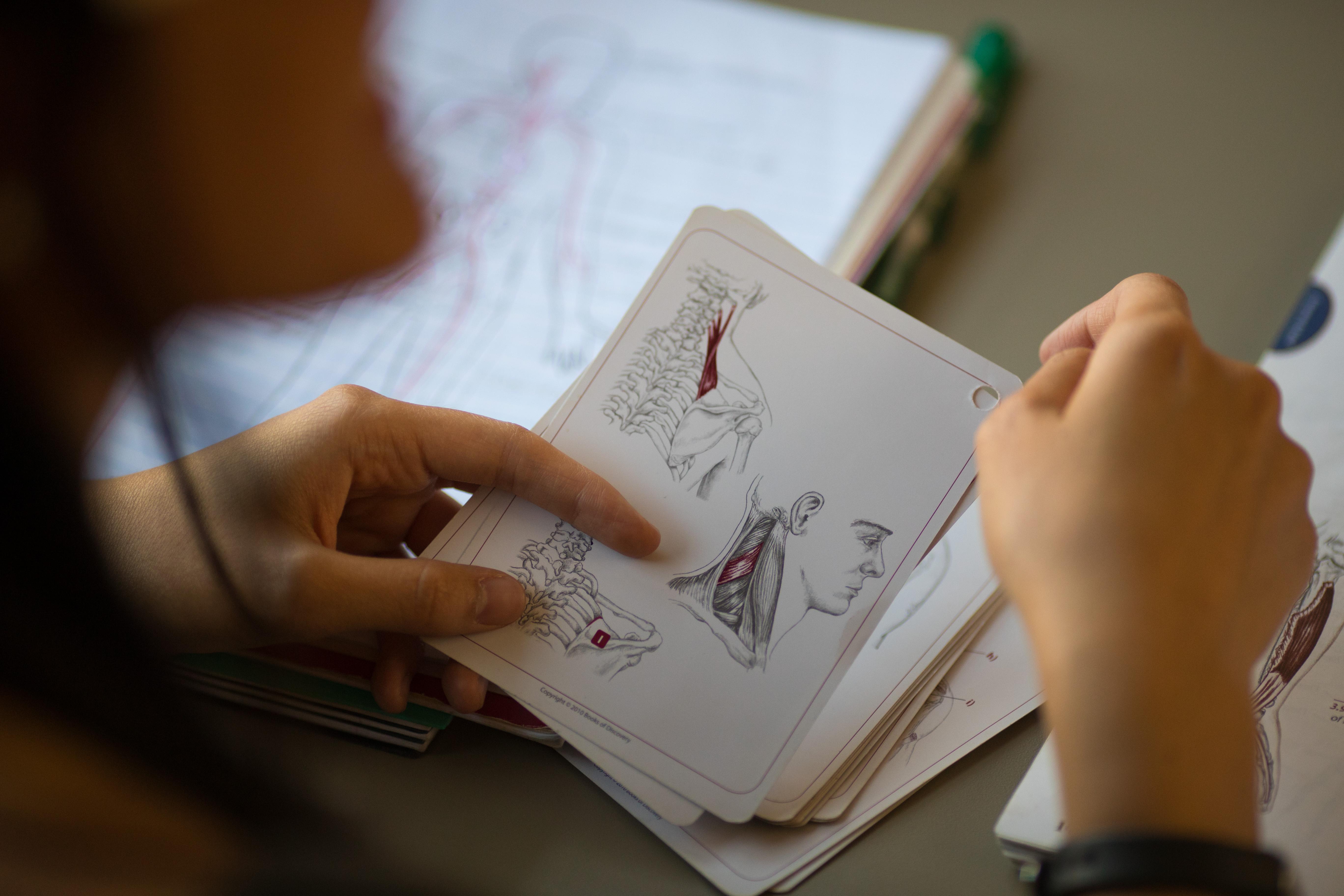 student taking notes in class