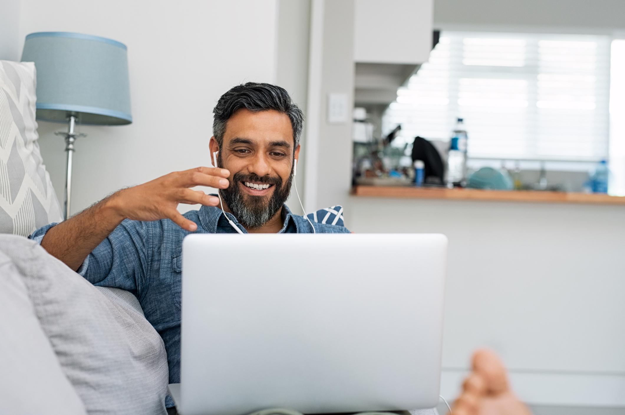 person chatting on laptop smiling