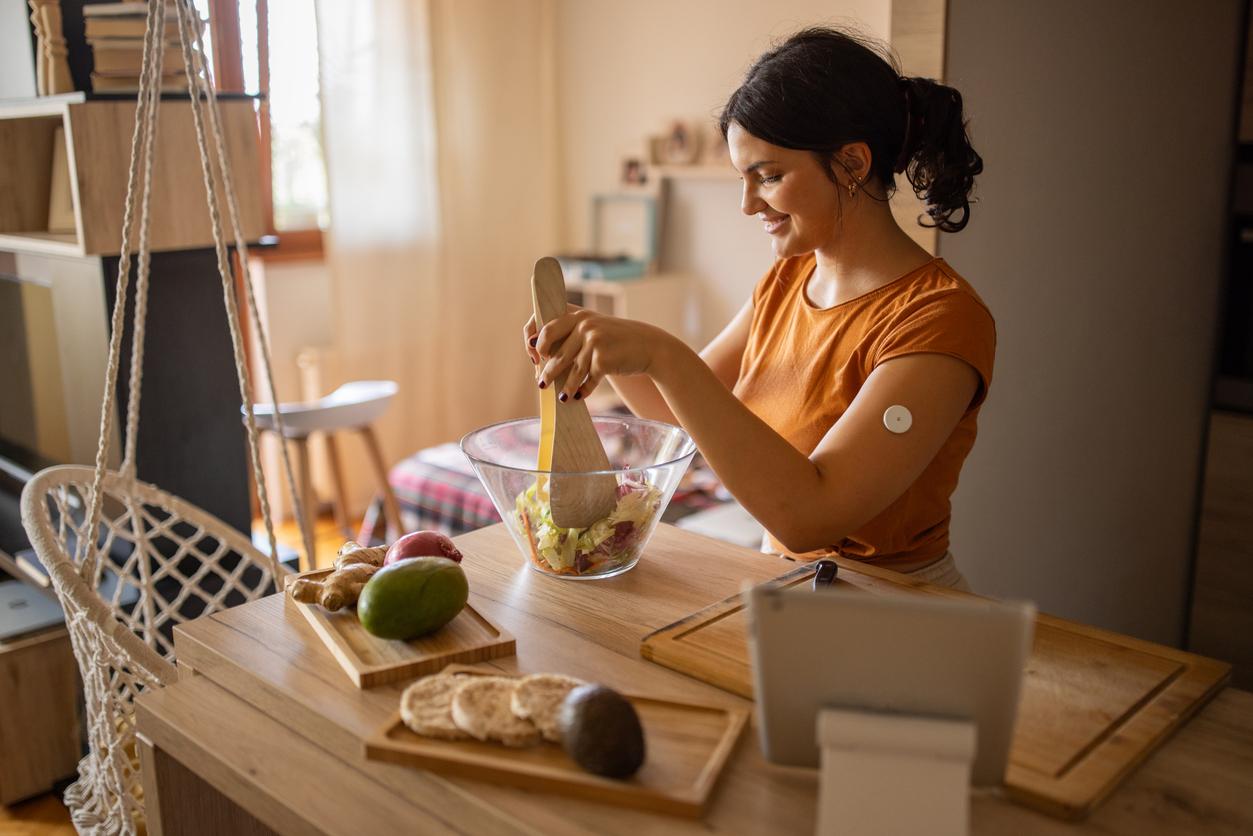 woman with cgm prepares lunch