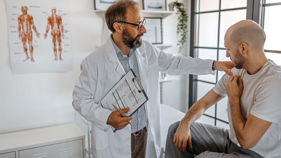 doctor examining patient's arm