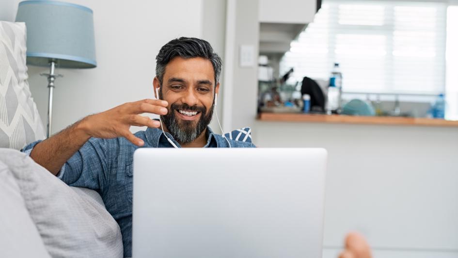 person chatting on laptop smiling